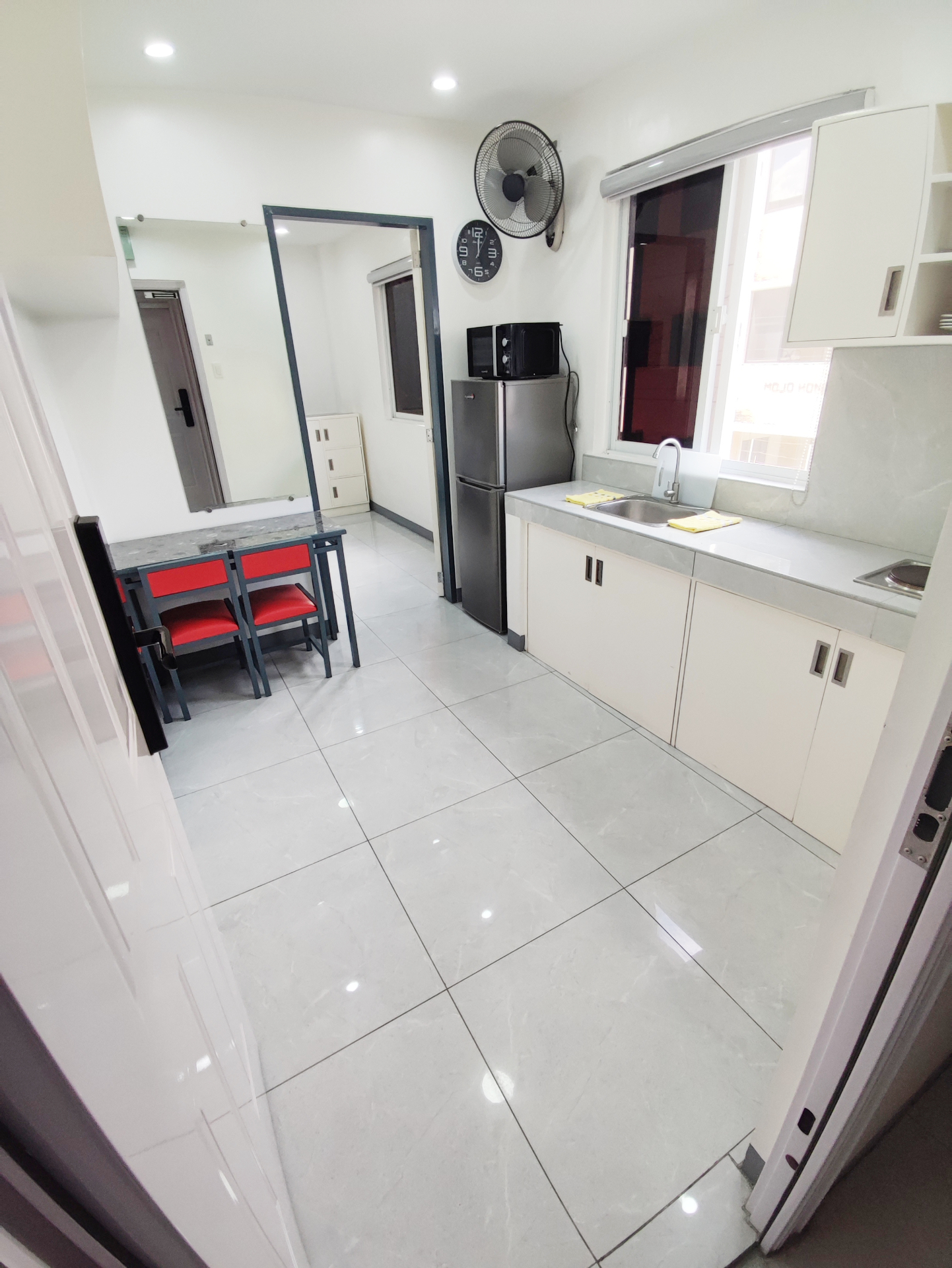 Doctor A CondoSuites kitchenette with dining table and refrigerator