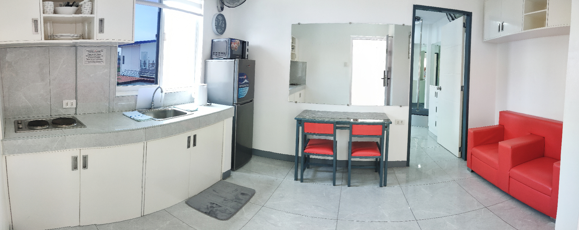 Doctor A CondoSuites open kitchen and lounge area