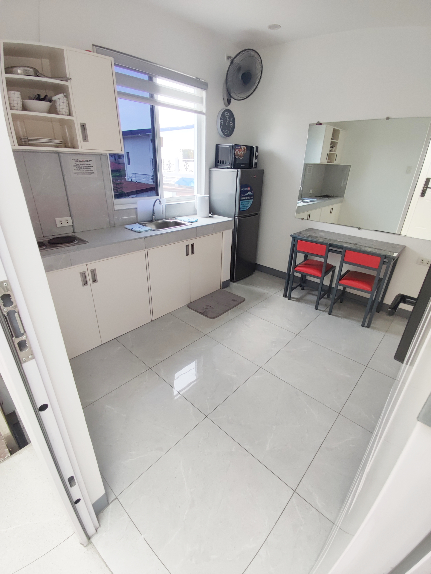 Doctor A CondoSuites bright kitchenette with dining set
