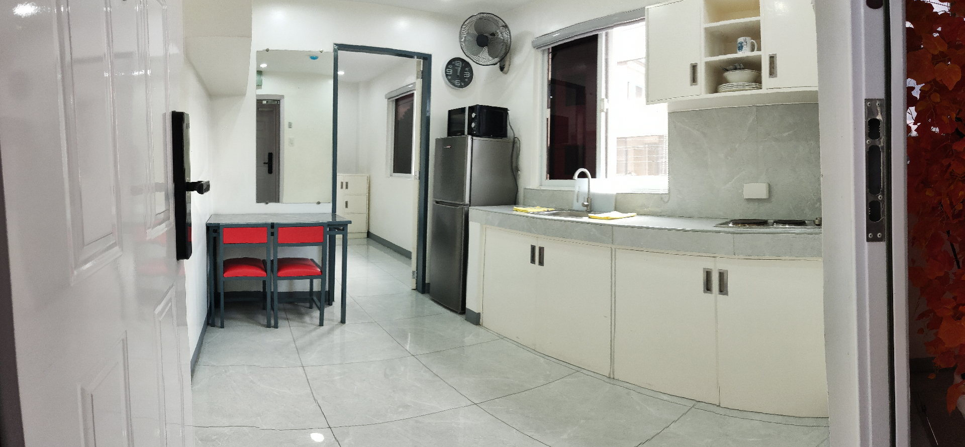 Doctor A CondoSuites kitchen and dining area panorama
